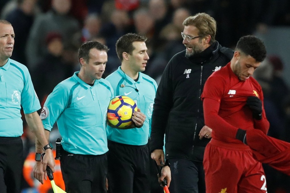 Jurgen Klopp speaks with referee Paul Tierney (centre) after the match. Photo: Reuters