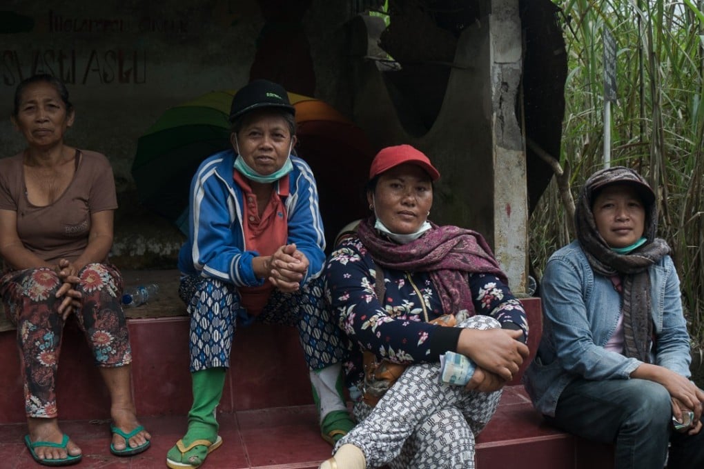 Ketut Suweni (second left) with colleagues after a day working in the gravel pit. Photo: Nathan Thompson