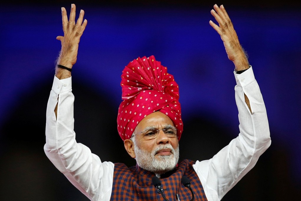 Narendra Modi addresses supporters at a campaign rally in Ahmadabad, Gujarat’s largest city. Photo: Reuters