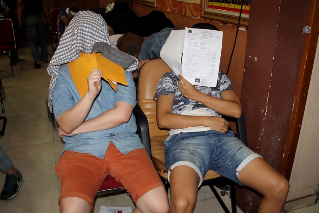 Men detained in a raid on a gay sauna on October 6. Photo: AFP