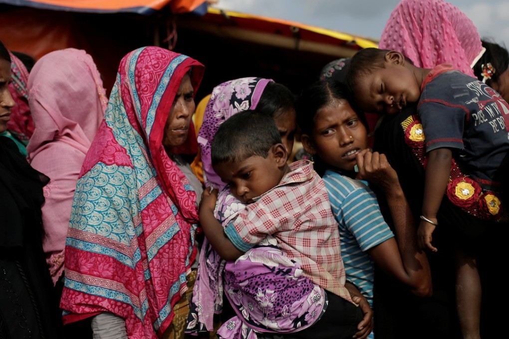 Rohingya refugees line up for a food supply distribution at the Kutupalong refugee camp near Cox’s Bazar in Bangladesh. Photo: Reuters