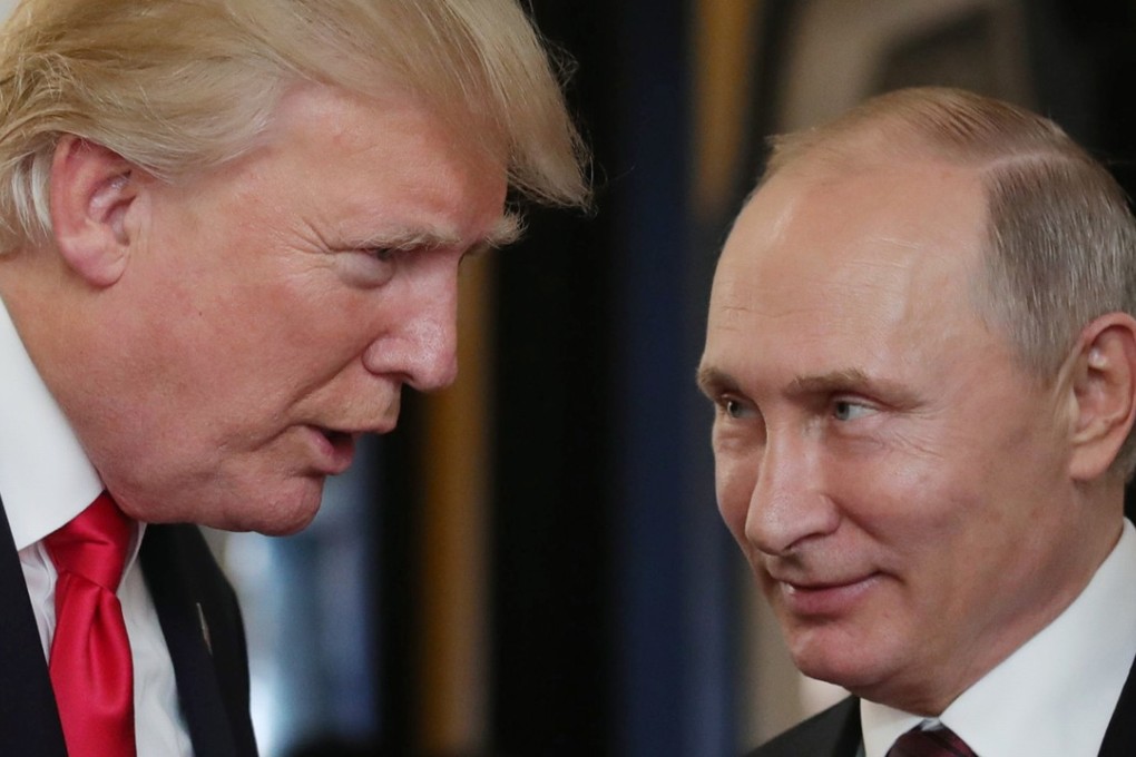This file photo taken on November 11 shows US President Donald Trump (left) speaking with Russian President Vladimir Putin at the APEC Economic Leaders’ Meeting in Danang, Vitenam. Photo: Agence France-Presse