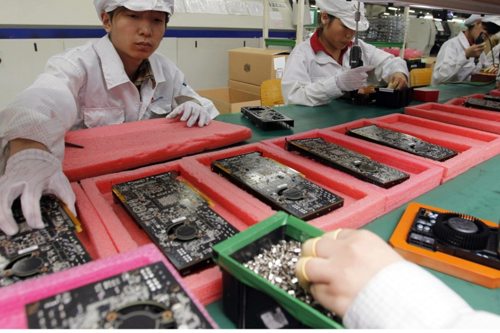 Workers at a Foxconn facility in the southern Chinese city of Shenzhen. The company employs about 1.5 million workers globally. Photo: AP