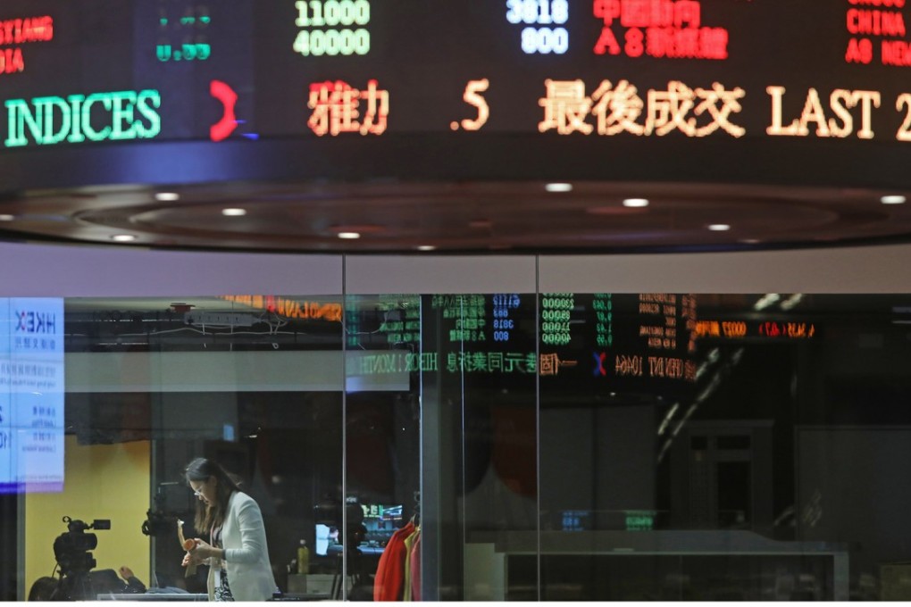 The trading hall in Hong Kong stock exchange. Hong Kong Exchanges and Clearing has raised the minimum requirements for companies seeking to lost on the bourse. Photo: Sam Tsang