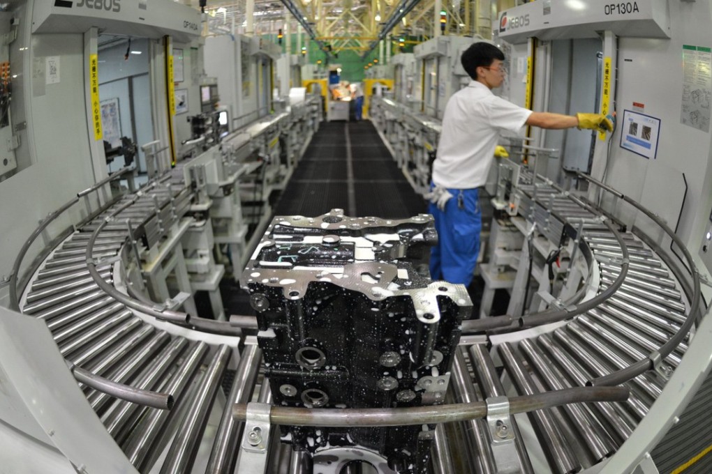 An employee at GM’s Wuhan factory in central China’s Hubei province. China is expected to set a flexible GDP growth target of between 6 to 6.5 per cent for 2018. Photo: AFP