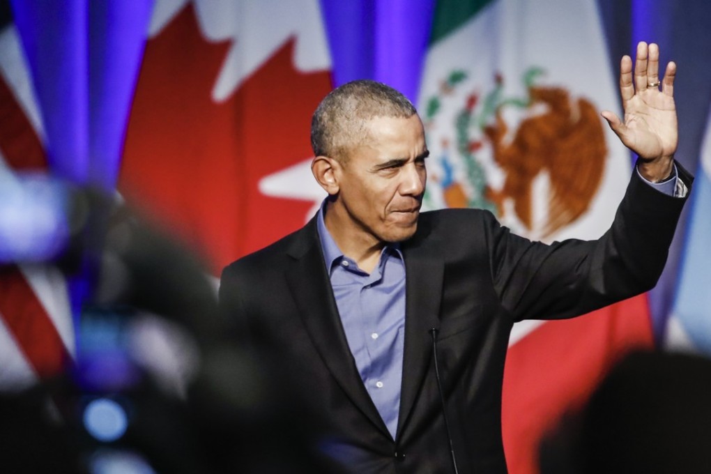 Former US president Barack Obama waves as he arrives to speak at the North American Climate Summit, in Chicago, Illinois, on December 5. Photo: EPA-EFE