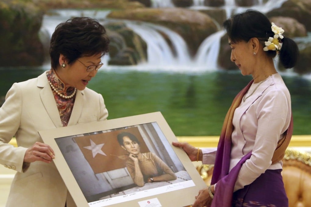 Hong Kong Chief Executive Carrie Lam presents a portrait showing a younger Aung San Suu Kyi, during her meeting with the Myanmar state counsellor in Naypyidaw on September 15. Photo: AP