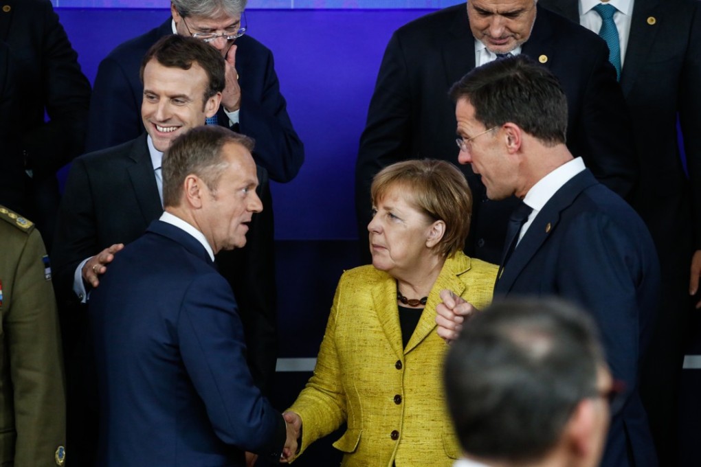 French president Emmanuel Macron, EU president Donald Tusk, president of the European Union (EU), second left, German chancellor Angela Merkel, centre, and Netherlands prime minister Mark Rutte speak during a European Union (EU) leaders summit at the Europa Building in Brussels, Belgium. Photo: Bloomberg