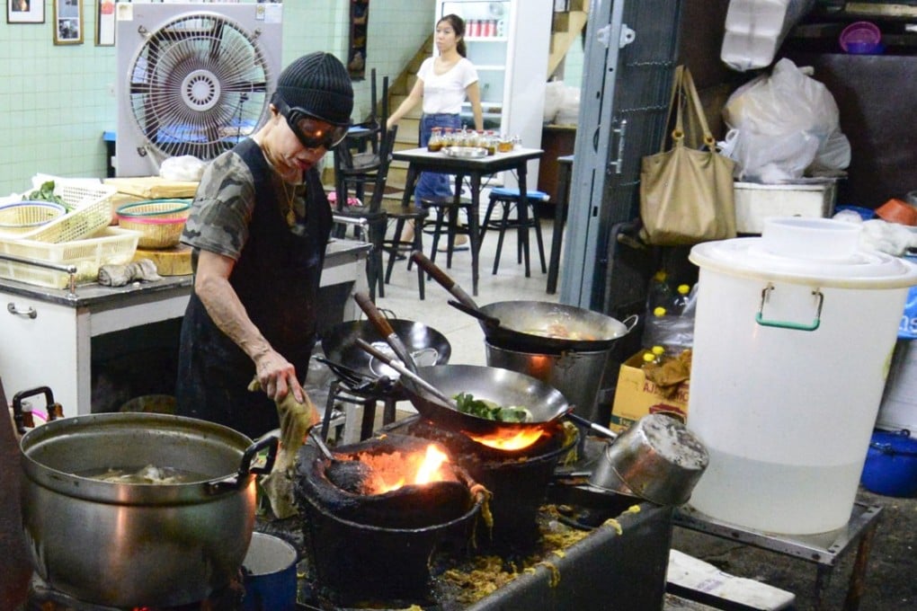 Chef Jay Fai cooks over charcoal burners in her one-Michelin-star restaurant Raan Jay Fai in Bangkok. Photo: Mason Florence