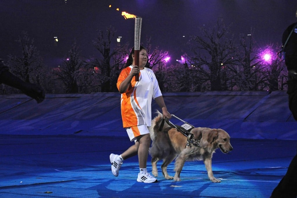 Ping Yali with her guide dog Lucky at the Beijing Olympics. Photo: AFP