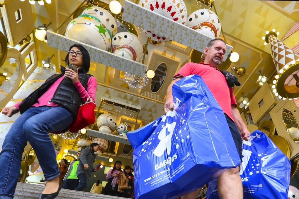 Customers shopping in Tsim Sha Tsui in December last year. Photo: Edward Wong