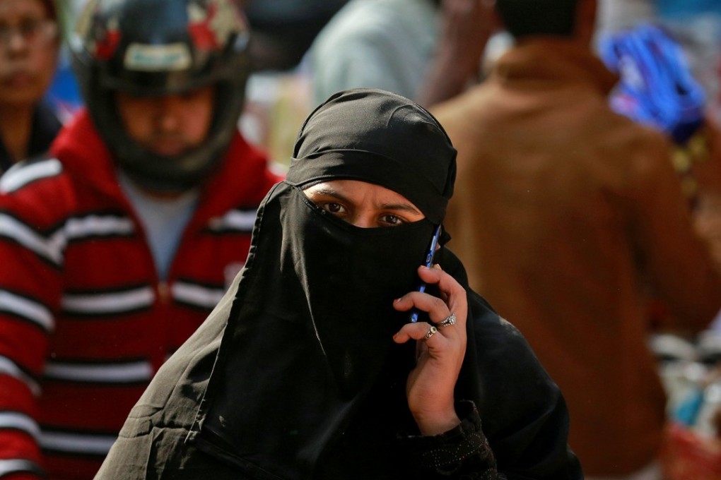 A Muslim walks through a market in New Delhi, India. There has been a spate of recent hate crimes against Muslims in India. Photo: Reuters