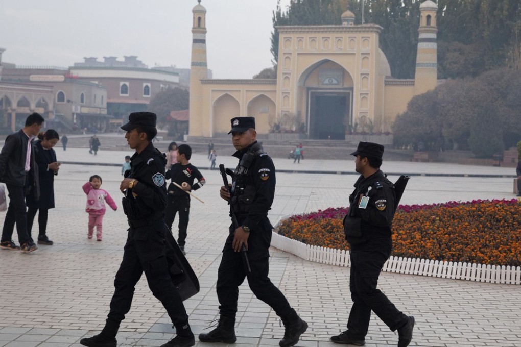 Security personnel patrol near the Id Kah Mosque in Kashgar, Xinjiang in November. Photo: AP
