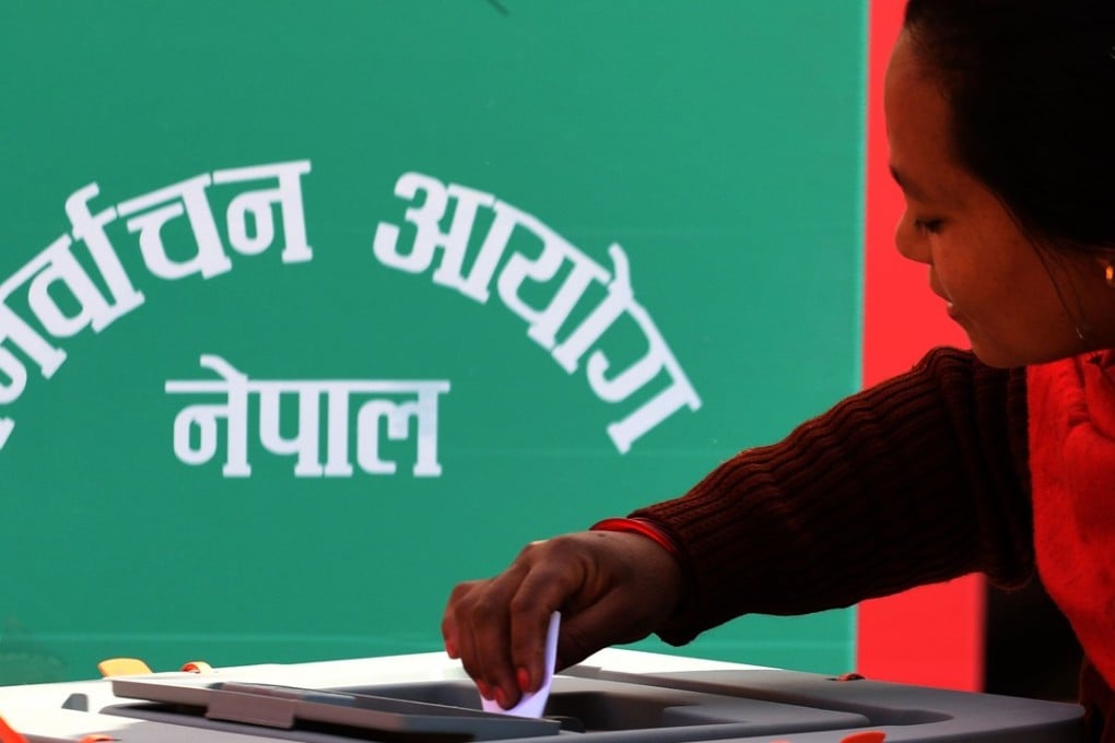 A Nepalese woman casts her ballot at a polling station in Bhaktapur on the outskirts of Kathmandu. A coalition of two communist parties secured about two-thirds of the seats in the country’s two legislative bodies. Photo: AFP