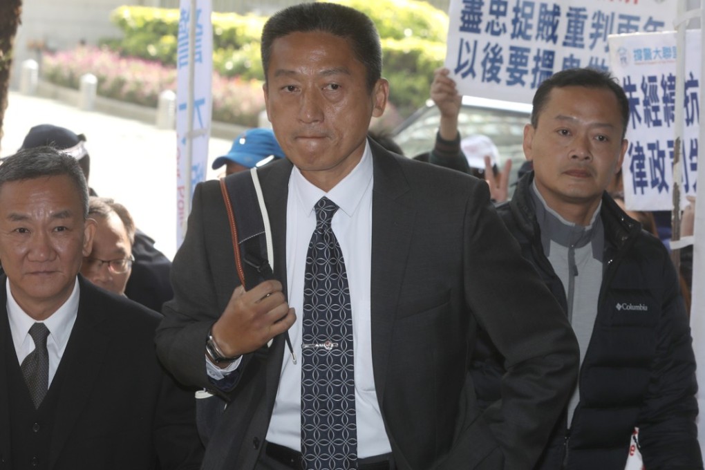 Frankly Chu (centre) was convicted of hitting a bystander with a 25cm baton weighing 350 grams. Photo: David Wong