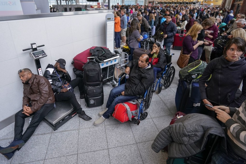 Passengers affected by a widespread power outage wait at the International Terminal of Hartsfield-Jackson Atlanta International Airport in Atlanta, Georgia, on Sunday. Photo: EPA