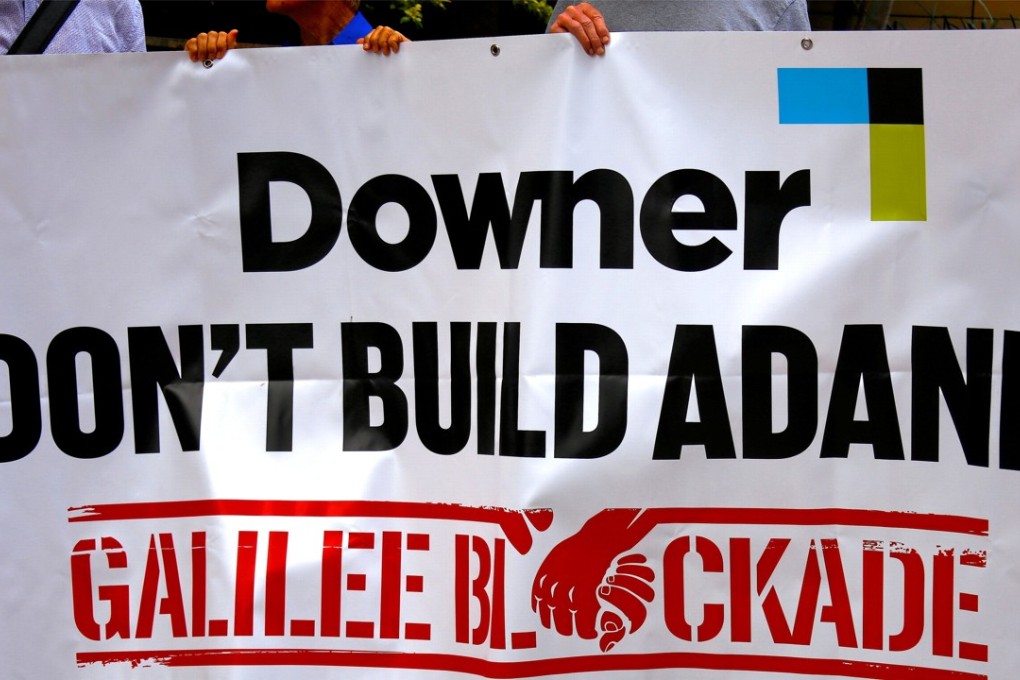 Protesters against the Indian conglomerate Adani Enterprises rally outside the venue for the Australian diversified mining contractor Downer EDI Limited's annual general meeting (AGM) in Sydney. File photo: Reuters