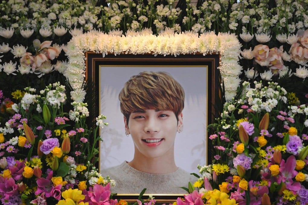 The portrait of Jonghyun, the 27-year-old lead singer of the massively popular K-pop boy band SHINee, is seen on a mourning altar at a hospital in Seoul. Photo: AFP