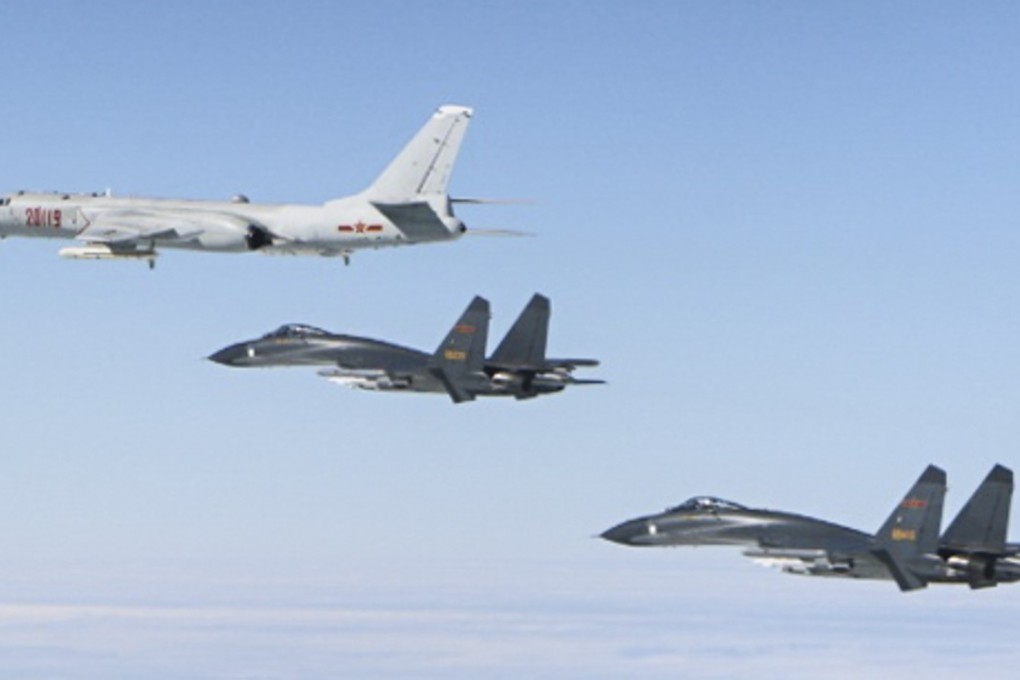 An H-6K bomber (top) is escorted by two Su-30 fighter jets during their “island encirclement” patrols near Taiwan. Photo: PLA air force