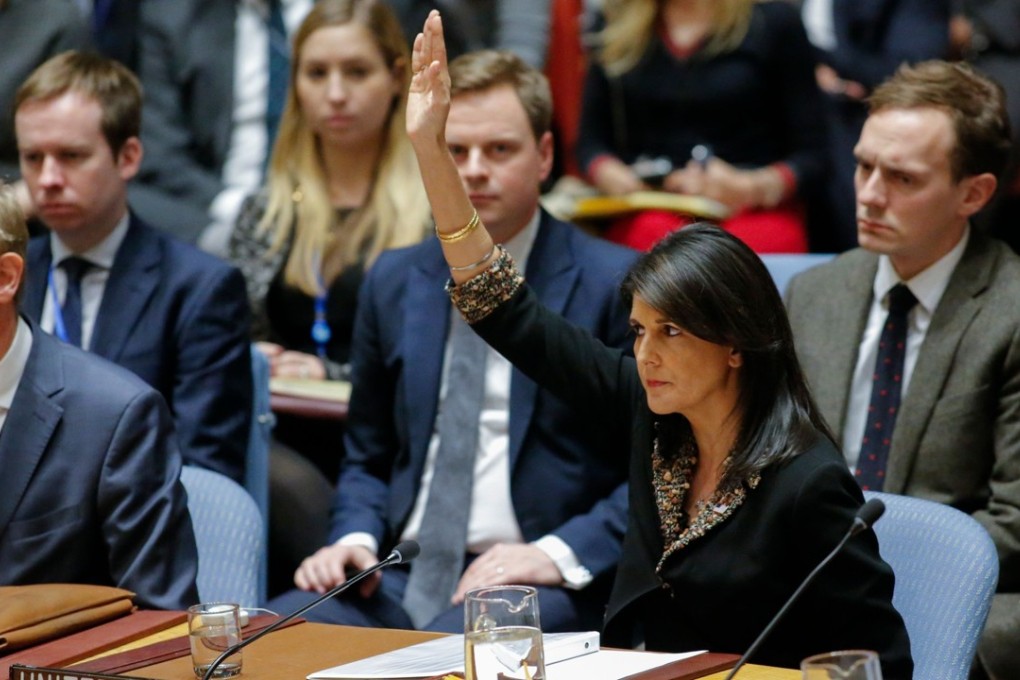 US Ambassador to the UN Nikki Haley raises her hand to veto a draft resolution that would reject US President Donald Trump's decision to recognise Jerusalem as the capital of Israel. Photo: AFP
