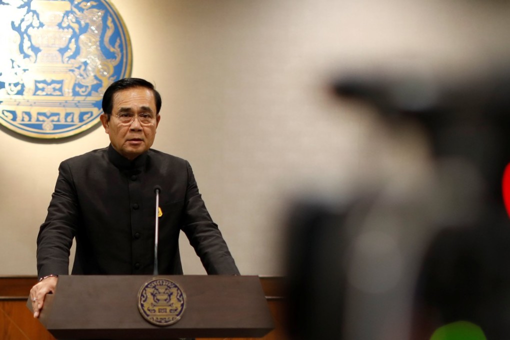 Thai Prime Minister Prayuth Chan-ocha has announced he will use powers to allow the military to lift a ban on political activities. Photo: Reuters