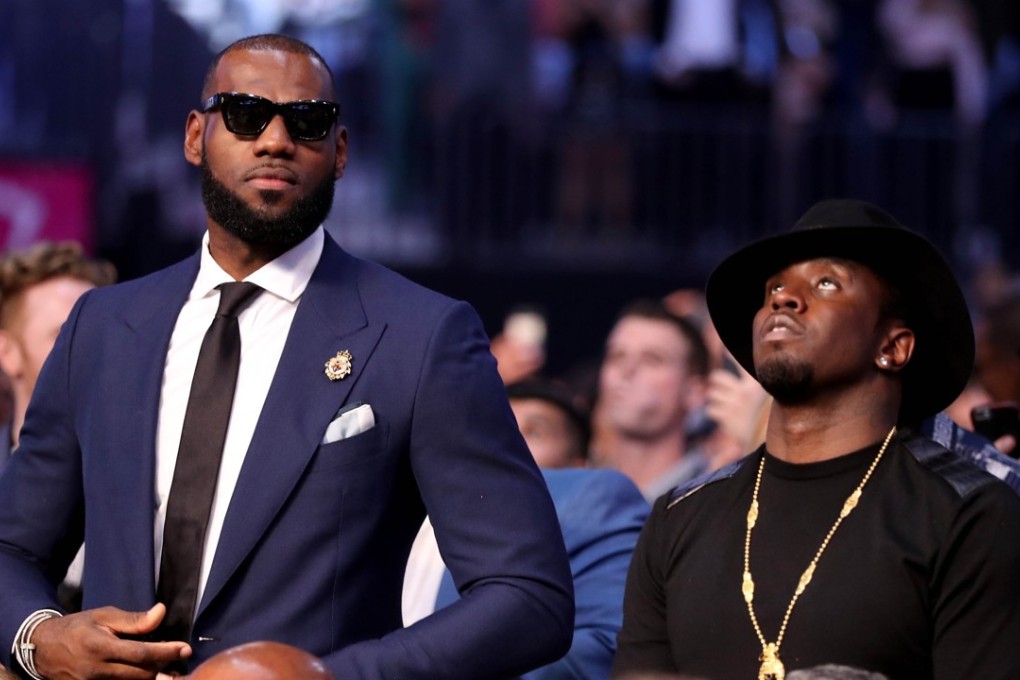 NBA star LeBron James and music mogul Sean “Diddy” Combs attend the fight between Floyd Mayweather Jnr and Conor McGregor. Photo: AFP