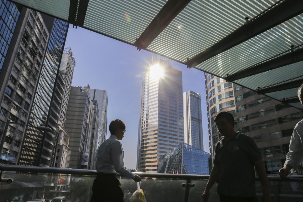 Commuters on the footbridge in Central. Hong Kong stocks were positive on Tuesday. Photo: Dickson Lee
