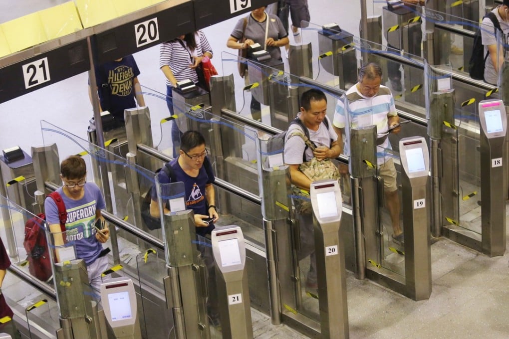 Cross-border travellers enter Hong Kong at the Lo Wu Control Point, in 2014. Photo: Nora Tam