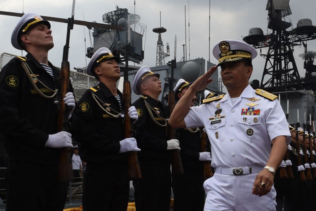 Ronald Joseph Mercado (right) while after visiting the Russian anti-submarine ship Admiral Tributs at the south pier in Manila. Photo: AFP