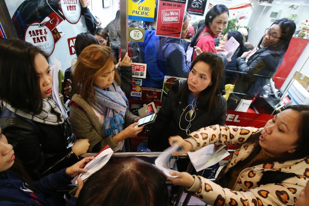 As word spread that Peya Travel was in trouble, angry customers crammed into the agency’s tiny cubicle shop in World-Wide House in Central. Photo: David Wong