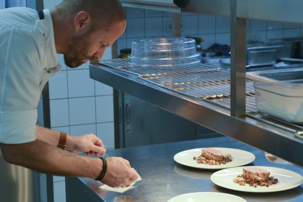 Chef Sidney Schutte plates up in the Librije’s Zusje kitchen in Amsterdam, the Netherlands. Photo: Chris Dwyer