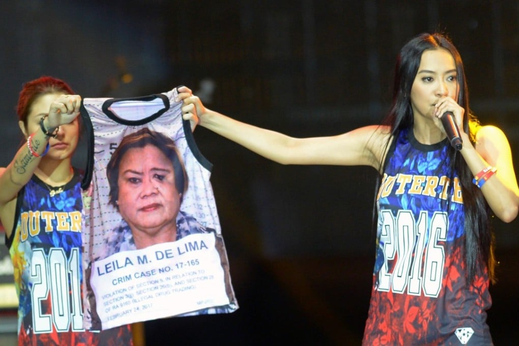 Mocha Uson, a blogger and supporter of Philippine President Rodrigo Duterte, displaying a T-shirt decorated with a photo of arrested legislator Senator Leila De Lima during a pro-Duterte rally. Photo: AFP