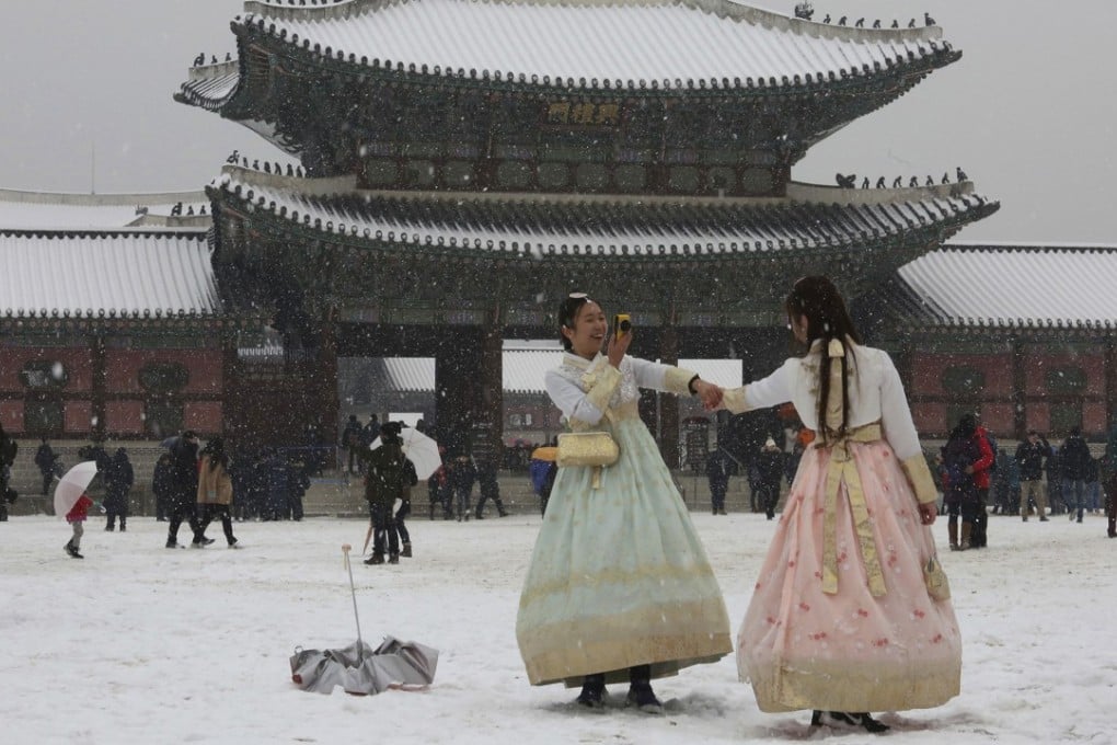 Tourists at the 14th century Gyeongbok Palace in Seoul on Monday. Photo: AP
