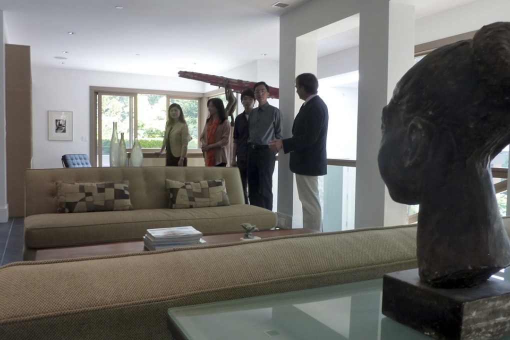 A wealthy Chinese immigrant family inspects a villa in West Vancouver, in this file photo. Photo: Agence France-Presse