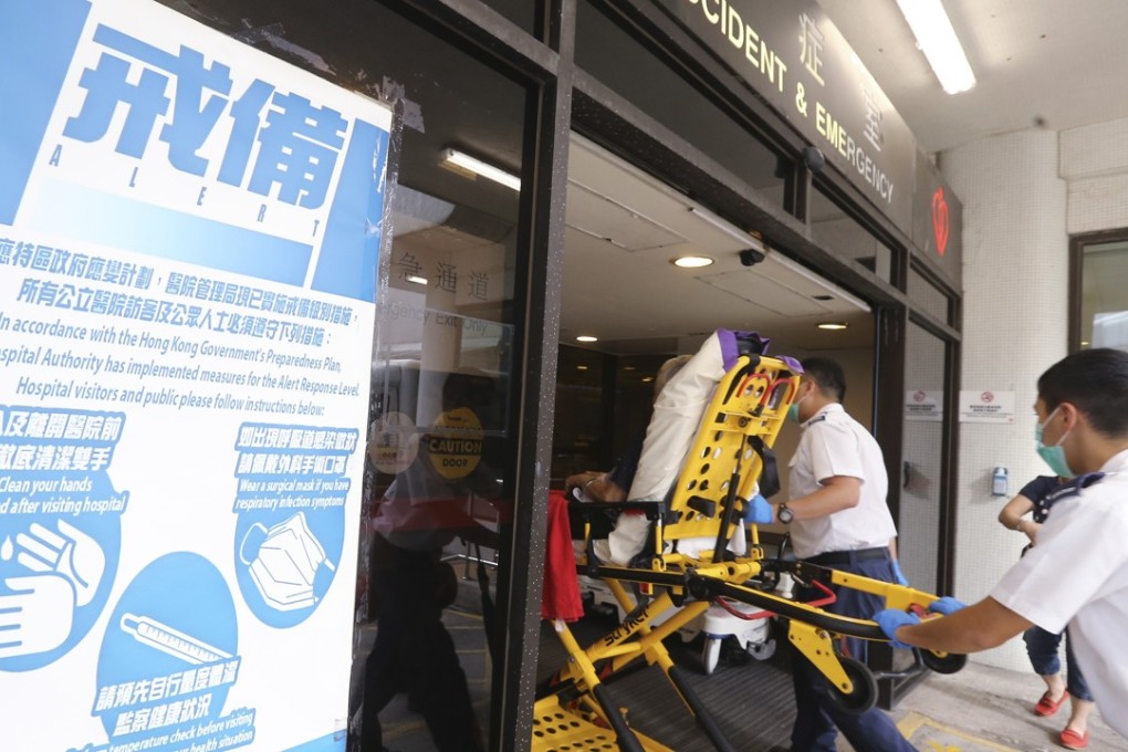 Notices are seen in Queen Mary Hospital alerting members of the public that a serious influenza pandemic response level has been activated. Photo: Dickson Lee
