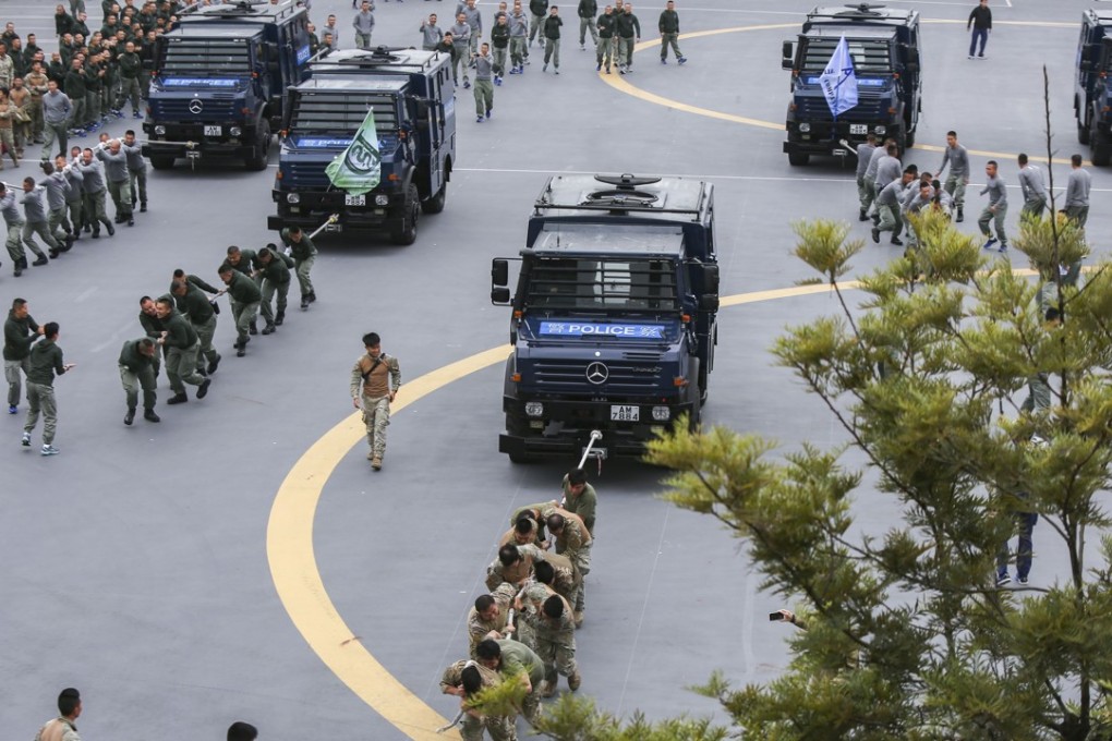 The ‘Unimog Pull’ is a highlight for police officers. The challenge is to pull the PTU’s signature armoured vehicles from one side of a square to the other in the quickest time. Photo: Xiaomei Chen