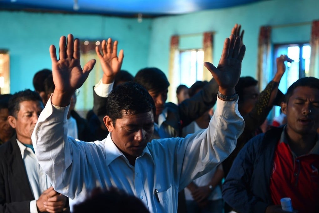 Nepali Christians take part in a church service in Lapa village in Dhading – some 100kms northwest of Kathmandu. Photo: AFP