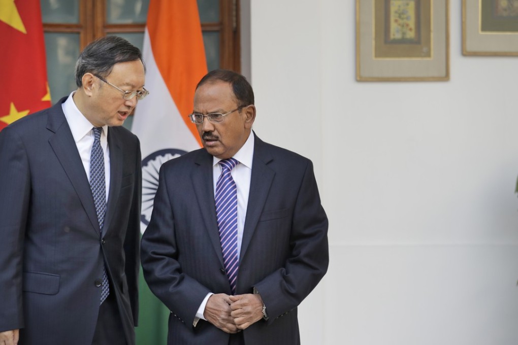 Chinese State Councillor Yang Jiechi (left) talks to Indian National Security Adviser Ajit Doval before their delegation-level meeting in New Delhi, India, on Friday. Photo: AP