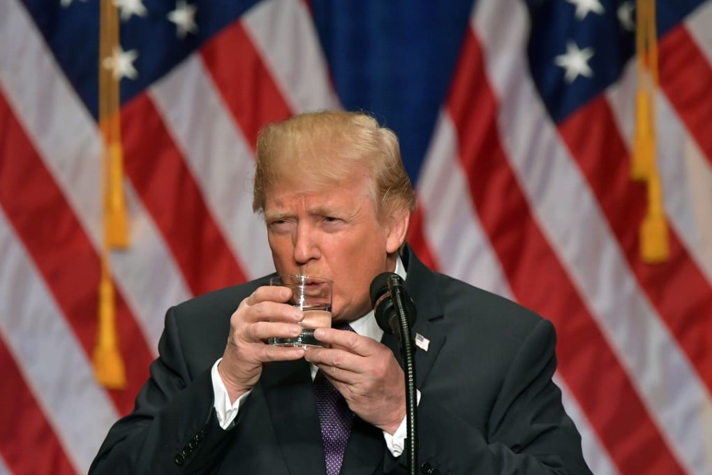 US President Donald Trump takes a drink of water as he speaks about his administration's National Security Strategy at the Ronald Reagan Building and International Trade Center in Washington, DC, December 18, 2017. Photo: Agence France-Presse