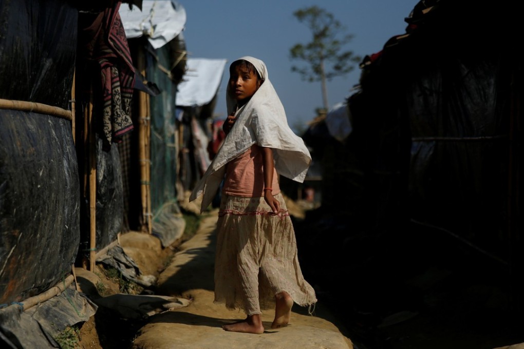 A Rohingya refugee girl makes her way at the Leda refugee camp near Cox's Bazar, Bangladesh. Photo: Reuters