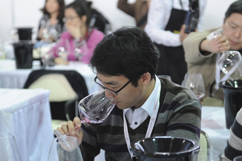 Chinese people take a wine tasting course at the VINISUD, the world's leading Mediterranean wines fair being held in Shanghai on February 27, 2013. China is catching up fast and is expected to become the world's sixth largest wine consumer by 2014. Photo: AFP