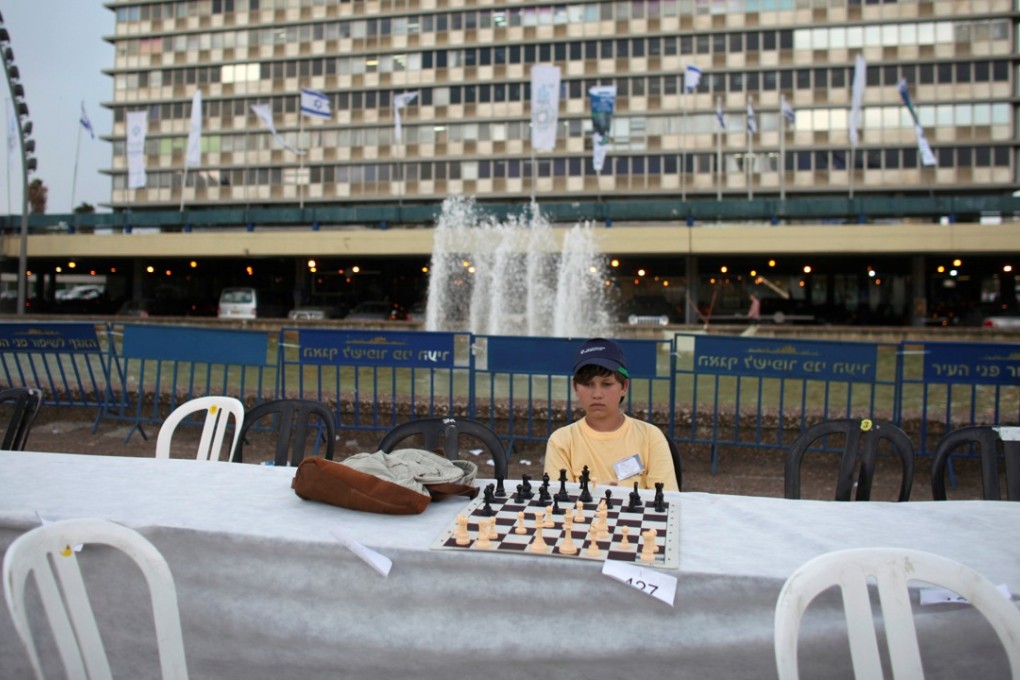File photo of a chess player looking at the board during a game against Israeli grandmaster Alik Gershon at Rabin Square in Tel Aviv. Photo: Reuters