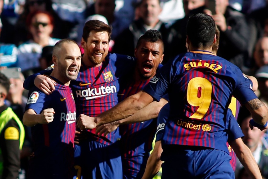 Luis Suarez celebrates with teammates after scoring for Barcelona against Real Madrid. Photo: AFP