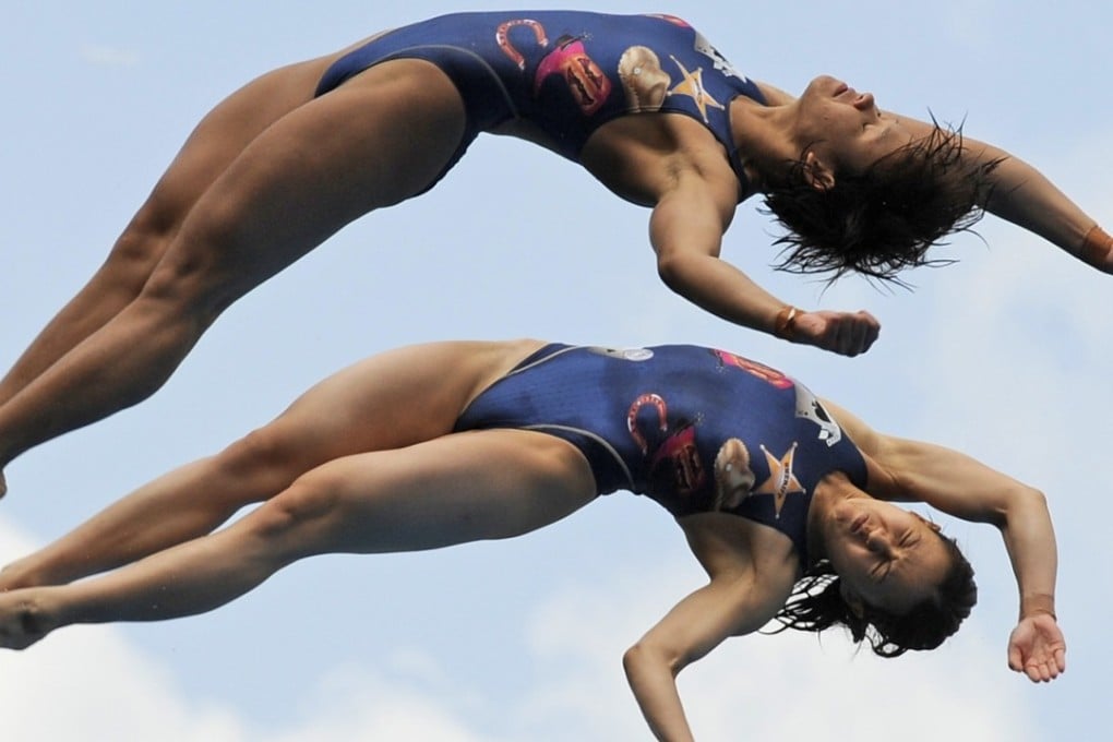 Malaysia's Pandelela Rinong (bottom) with Leong Mun Yee at the 2011 world championships. Photo: AFP