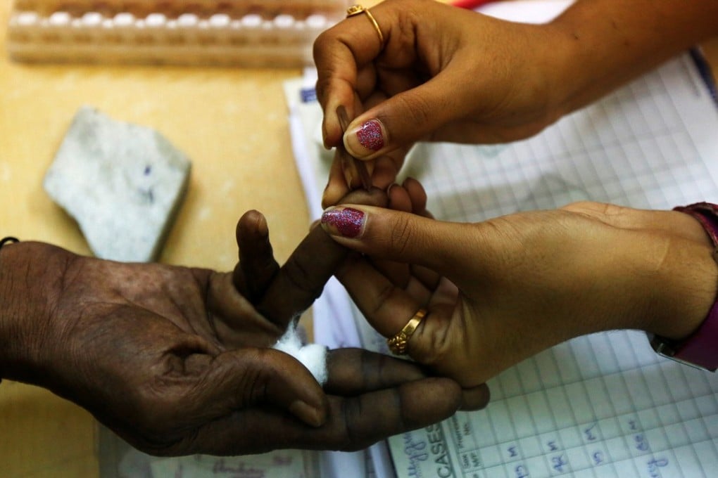 A government health worker collects a blood sample from a patient at a dengue detention centre in Calcutta, India. Photo: Reuters