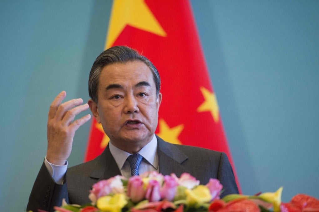 China's Foreign Minister Wang Yi speaks during a press conference with his Afghan and Pakistani counterparts in Beijing on Tuesday. Photo: Agence France-Presse