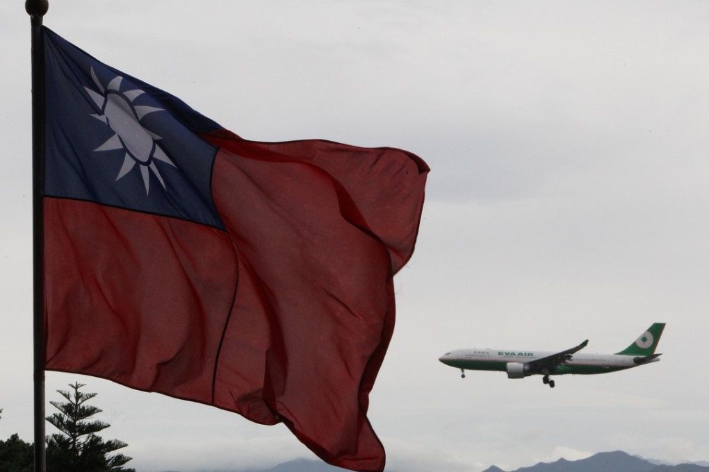 A file picture of Taiwan’s flag flying as a plane lands at Taiwan Taoyuan airport. Photo: SCMP Pictures
