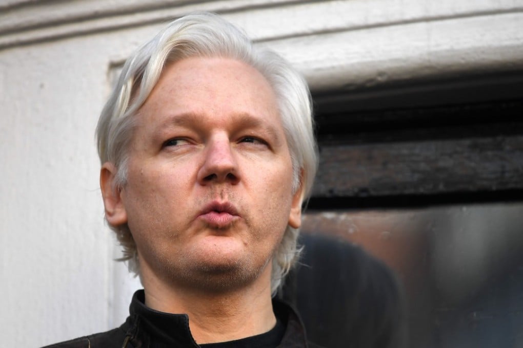 Wikileaks founder Julian Assange speaks on the balcony of the Embassy of Ecuador in London. Photo: AFP/Justin TALLIS