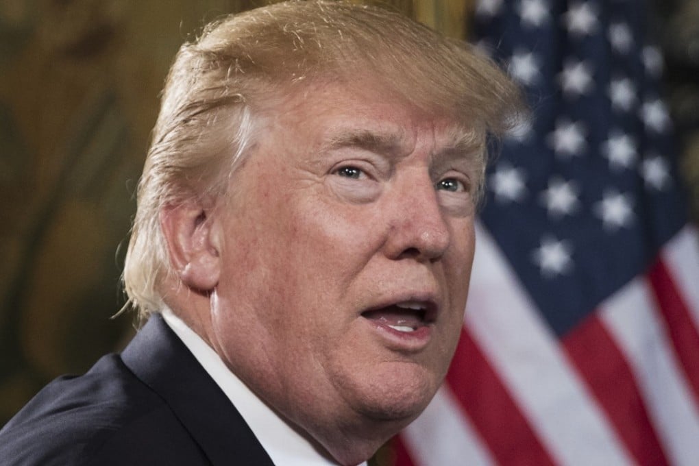 US President Donald Trump turns to talk to the gathered media at his Mar-a-Lago estate in Palm Beach, Florida, on December 24. Photo: AP