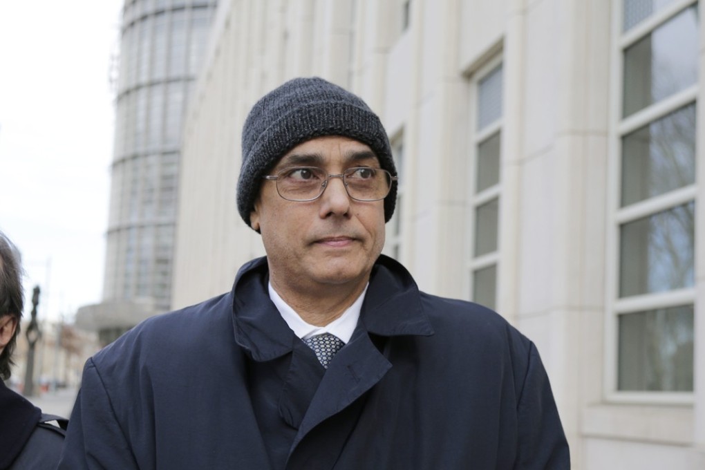 Manuel Burga leaves federal court in Brooklyn, New York, on Tuesday. The former South American soccer official, who was charged in a US trial stemming from the Fifa bribery scandal, was acquitted of a corruption charge. Two others were convicted in the case last week. Photo: AP